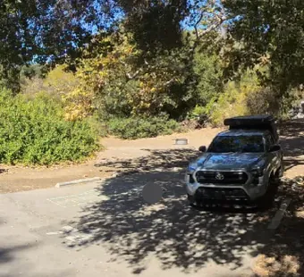 Leo Carrillo site 74, 360 photo: storage bins on the left, truck parked on the site to the right