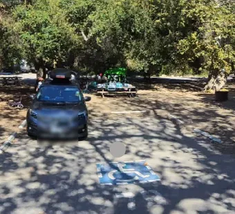 Leo Carrillo site 79, 360 photo: one car parked, gear laid out nearby, faces blurred
