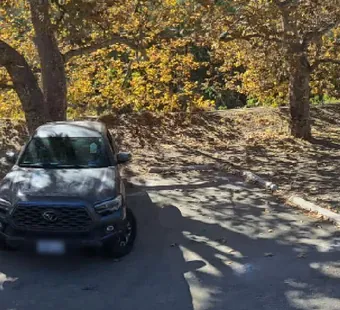 Leo Carrillo site 94, 360 photo: one suv parked, faces blurred nearby
