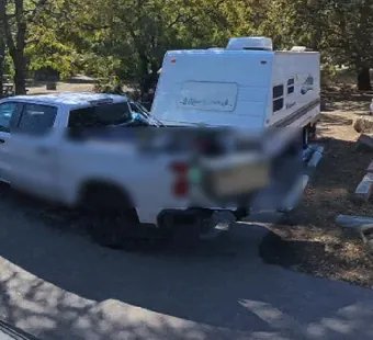 Leo Carrillo site 121, 360 photo: truck and travel trailer parked, faces blurred nearby