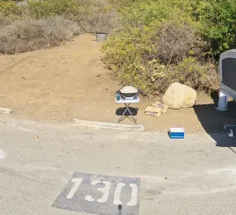 Leo Carrillo site 130, 360 photo: pop-up trailer with the tent ends open, one car parked